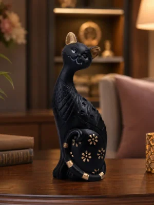 Black Cat Decorative Showpiece Statue made of polyresin displayed on a luxury wooden table in a modern living room, elegant home décor accent for shelves, offices, and gifting.