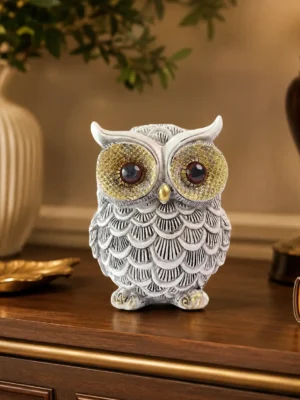 Luxury owl showpiece resin statue for home décor with golden eyes and vintage design