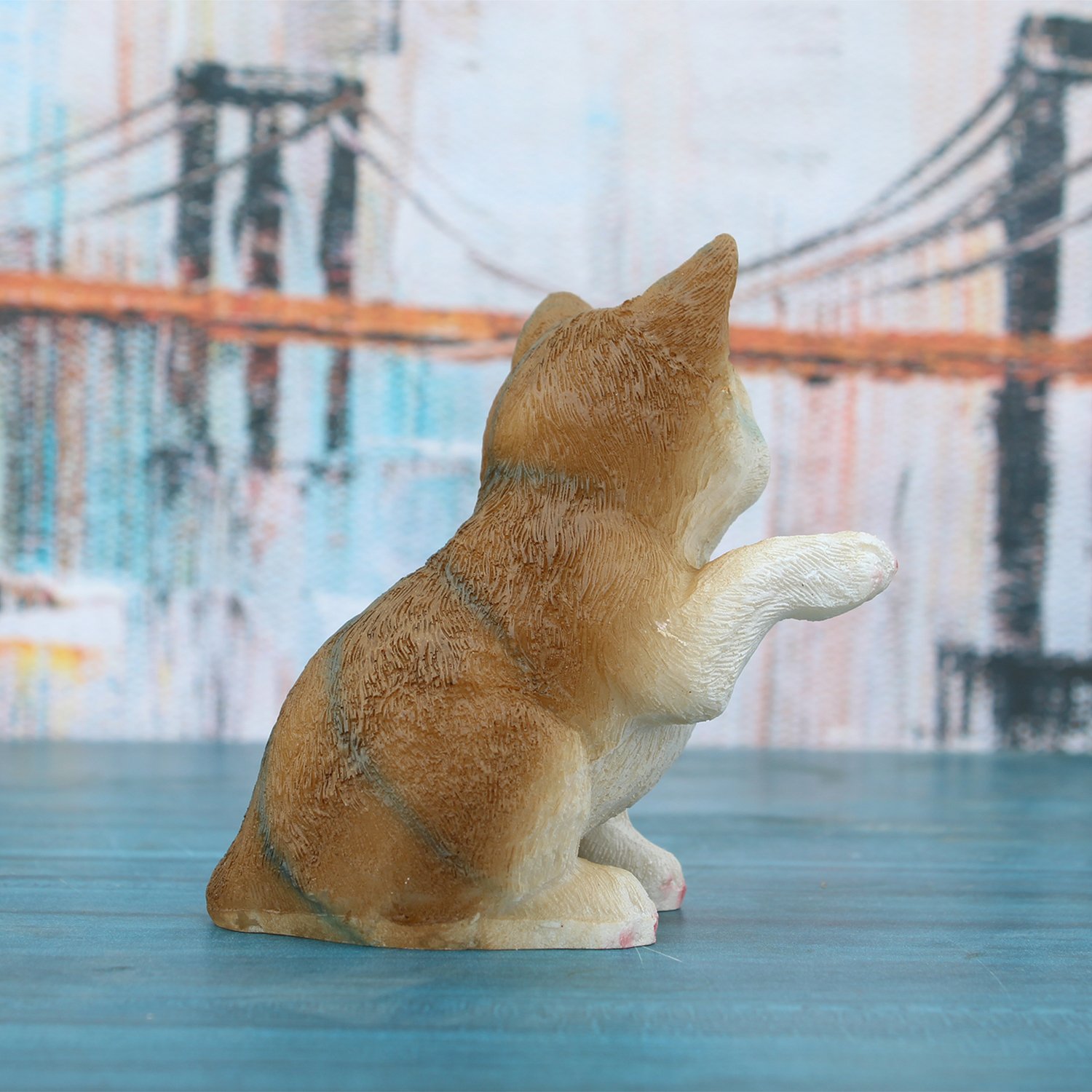 A handcrafted 12.5cm Brown resin cat figurine, perfect for modern home styling.