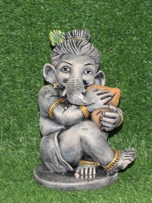 Small grey polyresin Ganesh idol holding modak, decorative Ganpati statue for home and office desk decor
