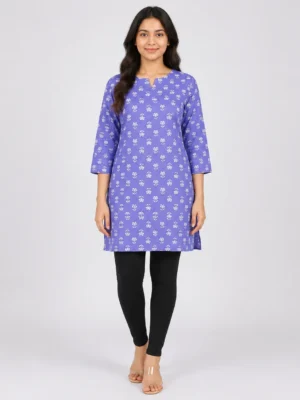 Full front view of a woman wearing a lavender blue floral printed cotton short kurti with black leggings