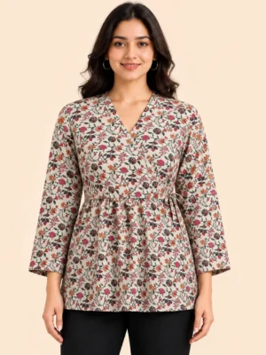 Women's floral print wrap style hip length kurti in beige featuring a V-neckline, full sleeves, adjustable waist tie, and multicolor floral pattern. Styled with black pants, this lightweight casual kurti from Voniva Fashion is ideal for everyday wear, office wear, and festive casual occasions. High-quality studio product image with clear fabric texture and stitching details.