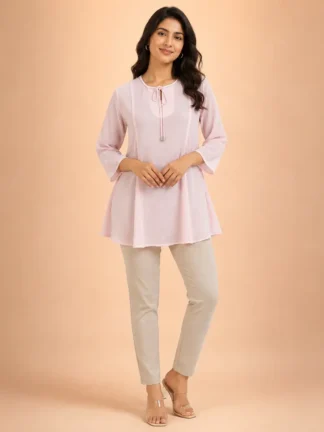 Women wearing light pink georgette A-line tunic top with keyhole neck