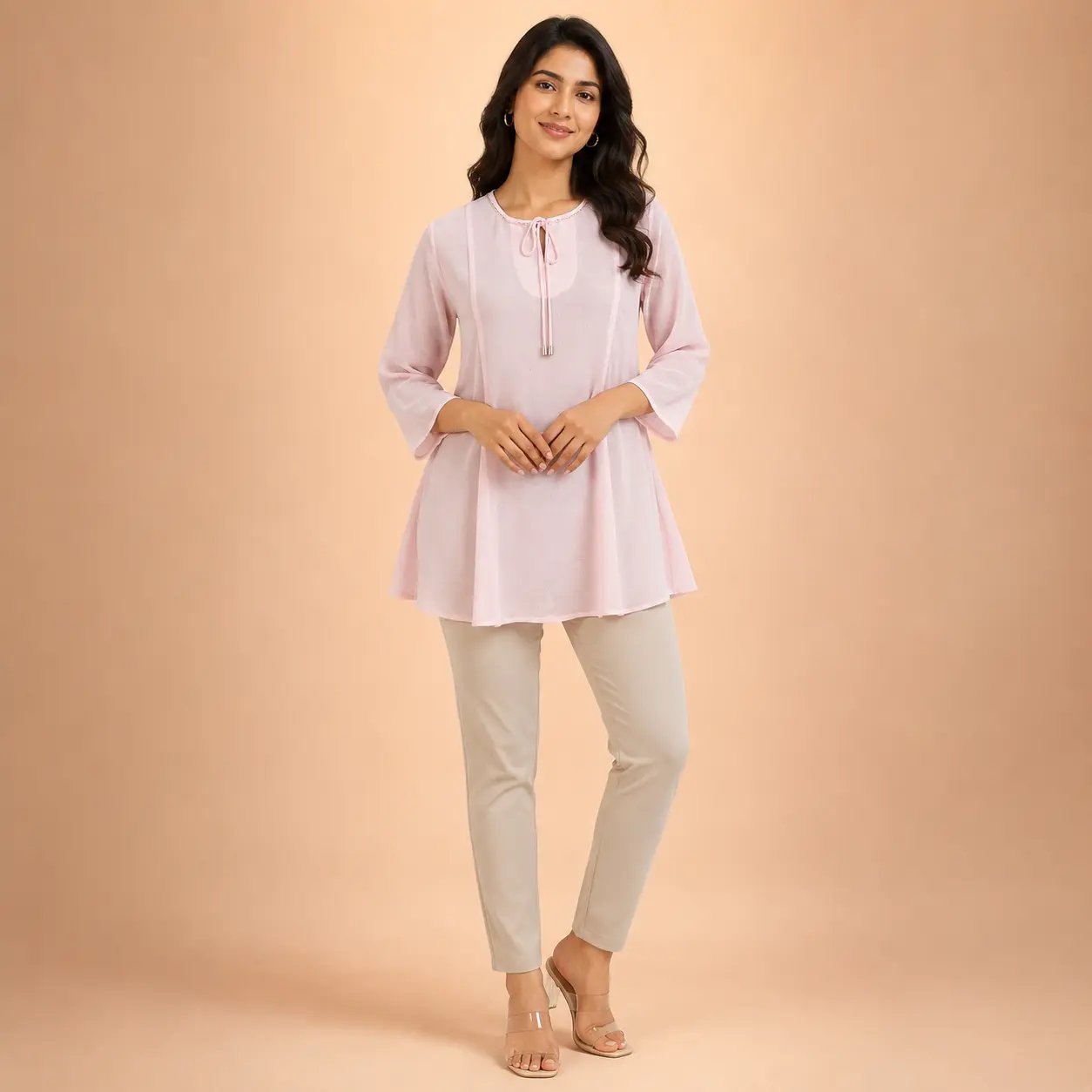 Women wearing light pink georgette A-line tunic top with keyhole neck