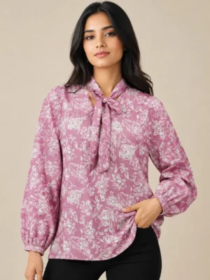 Front view of women pink floral printed cotton top with tie neck tie up collar