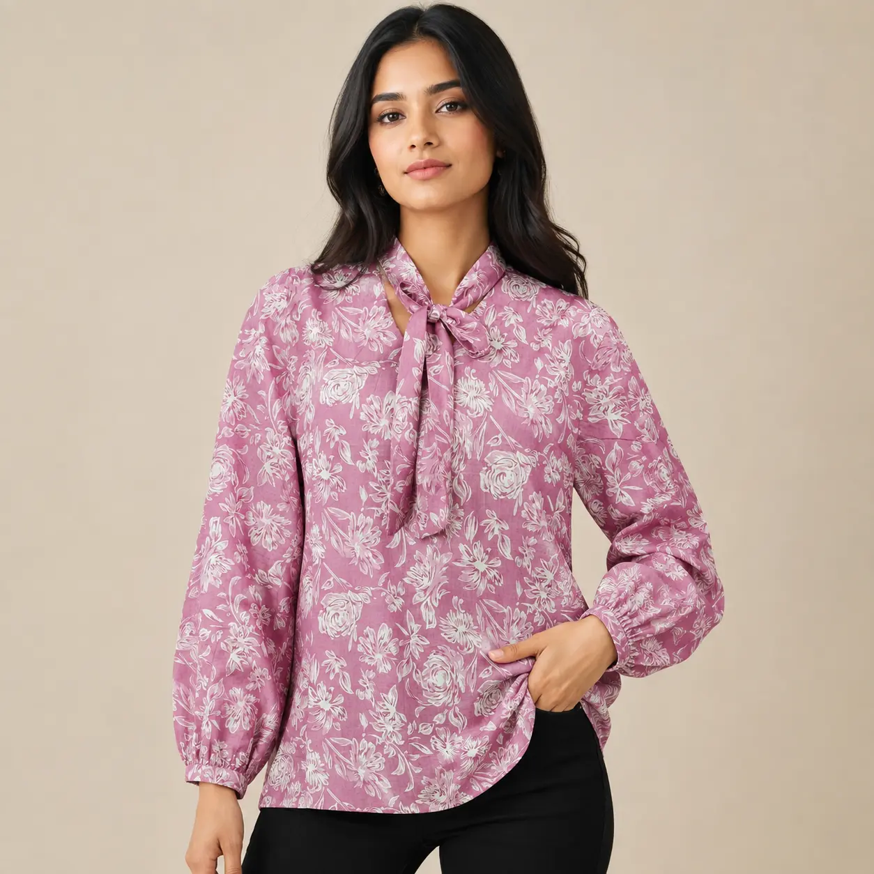 Front view of women pink floral printed cotton top with tie neck tie up collar