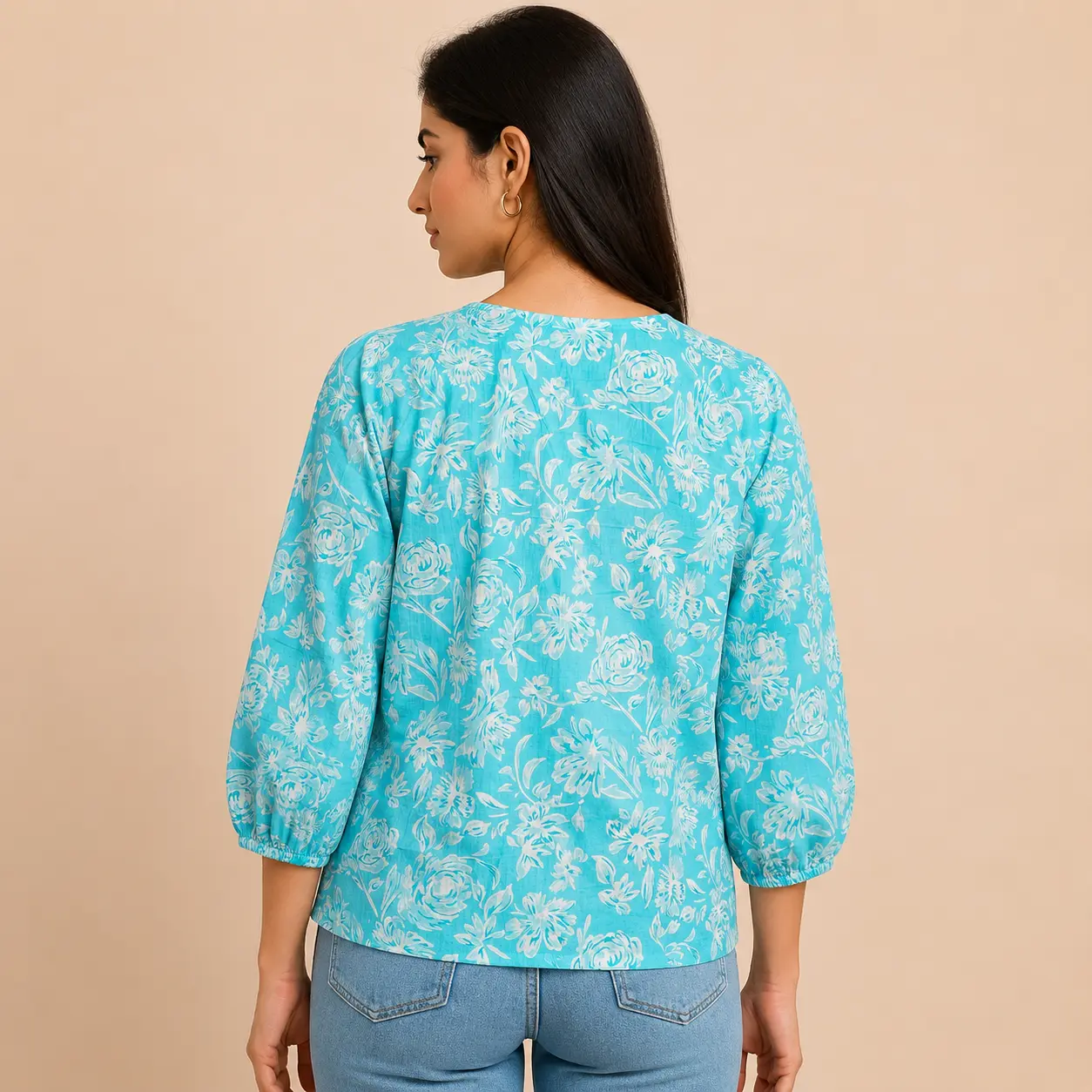 Back view of stylish sky blue floral print cotton blouse with 3/4 sleeves for women