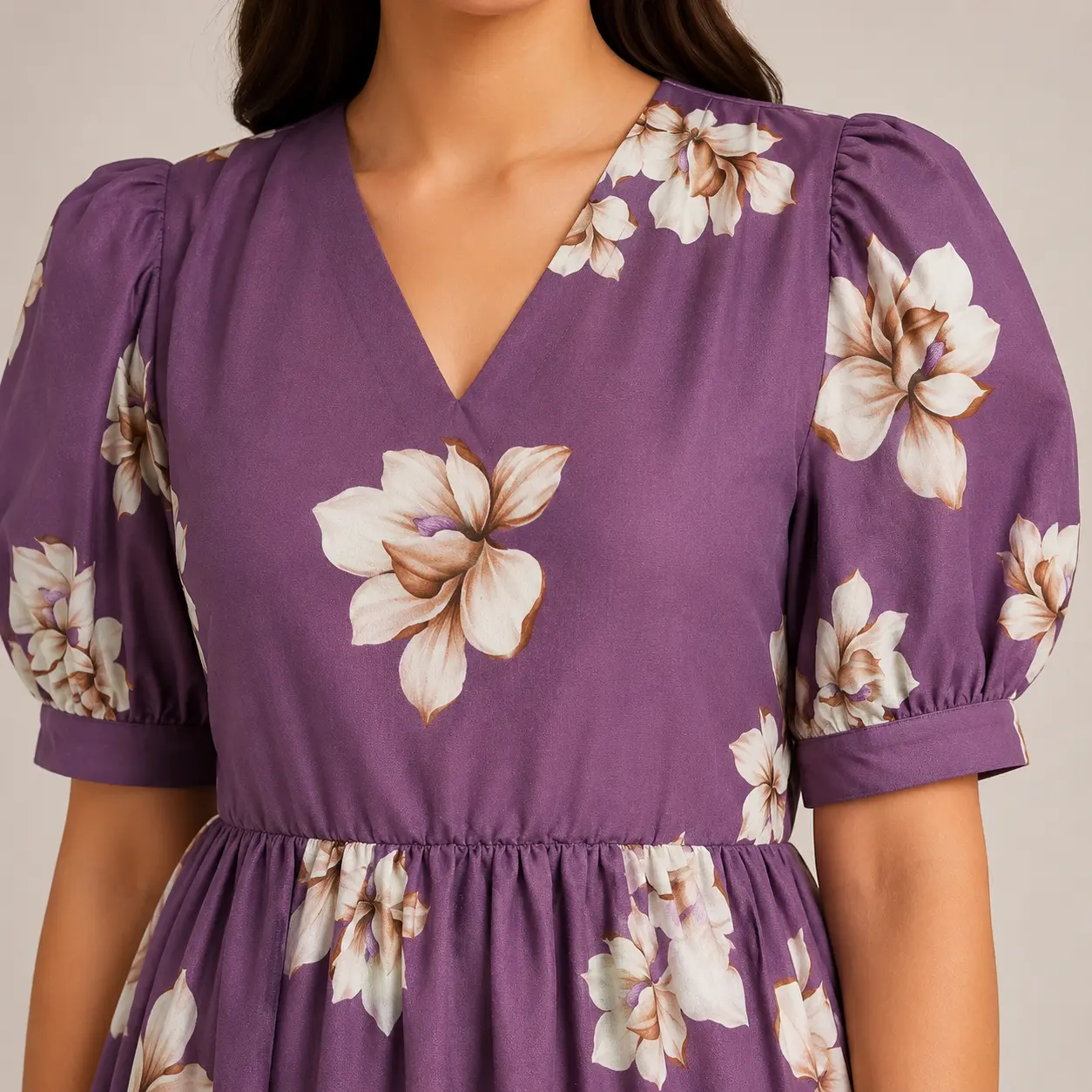 Close-up of V-neckline and puff sleeves on floral dress for women