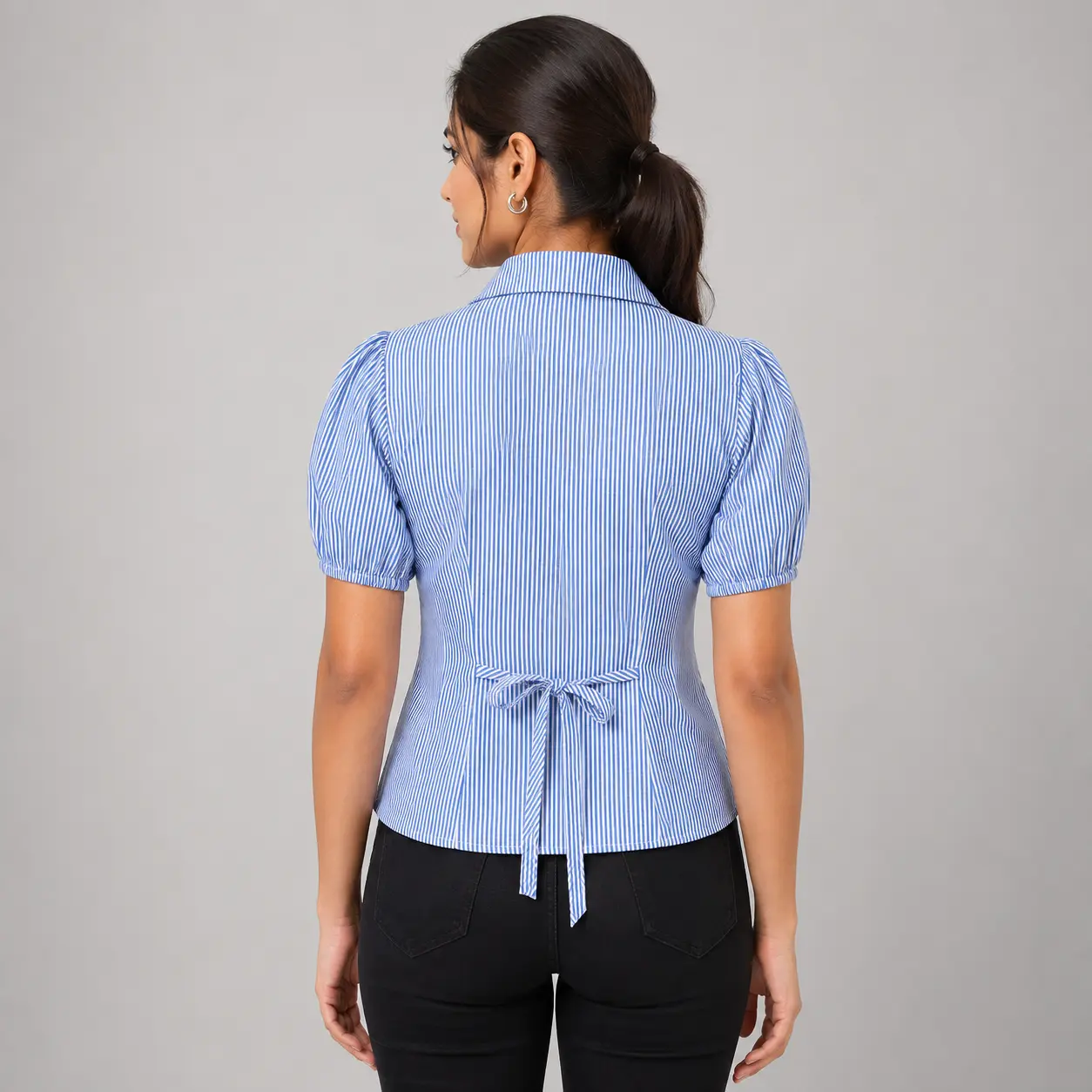 Blue and white striped women’s top back view