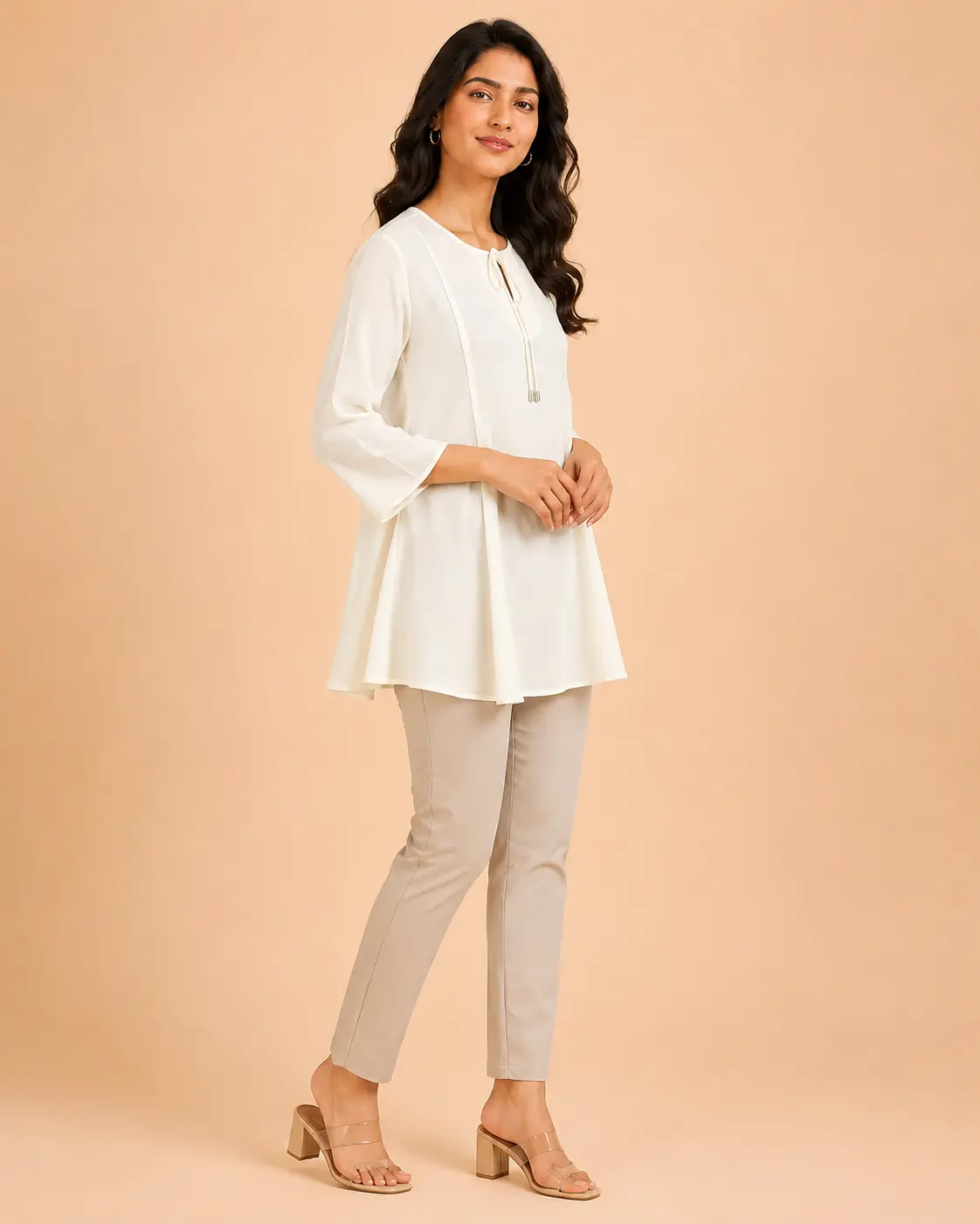 long off white georgette tunic top for women side view showing fluid drape and flared silhouette